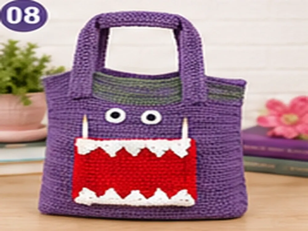 Finished purple, green, red and white Snack Monster crochet tote